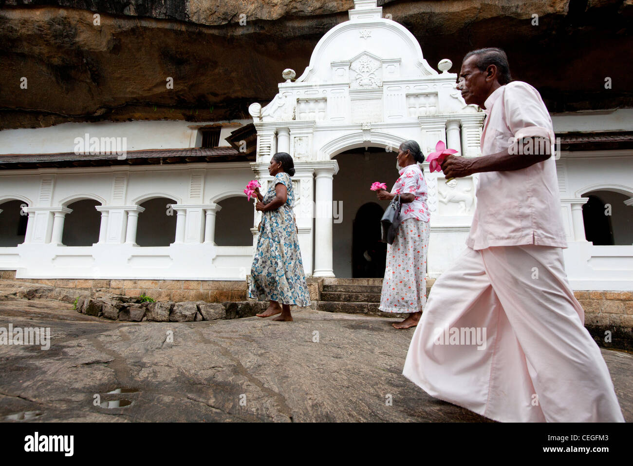 People passing Royal Rock Temple Dambulla Sri Lanka Asia Stock Photo