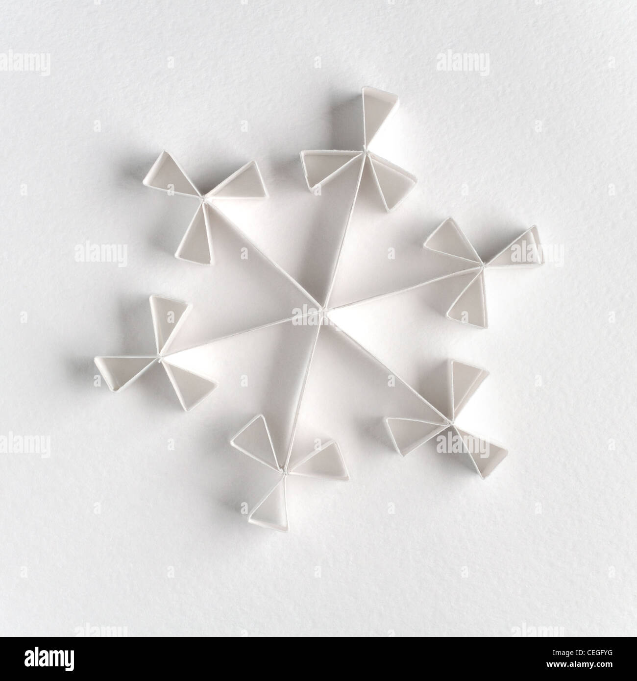 Snowflake made of paper on white background Stock Photo - Alamy
