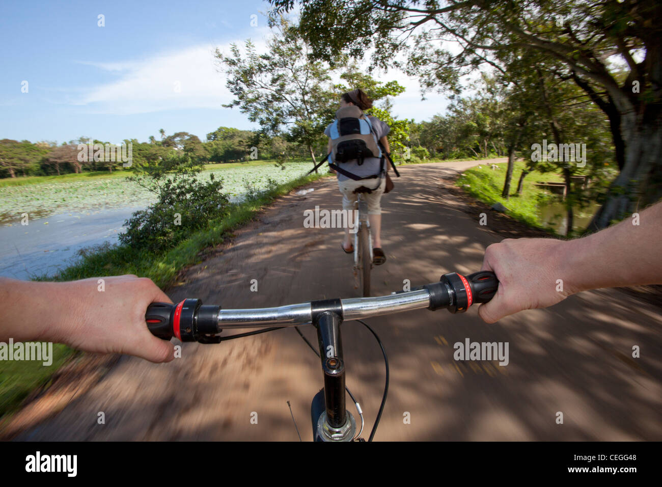 People cycling bicycle handlebar Anuradhapura Sri Lanka Asia Stock Photo