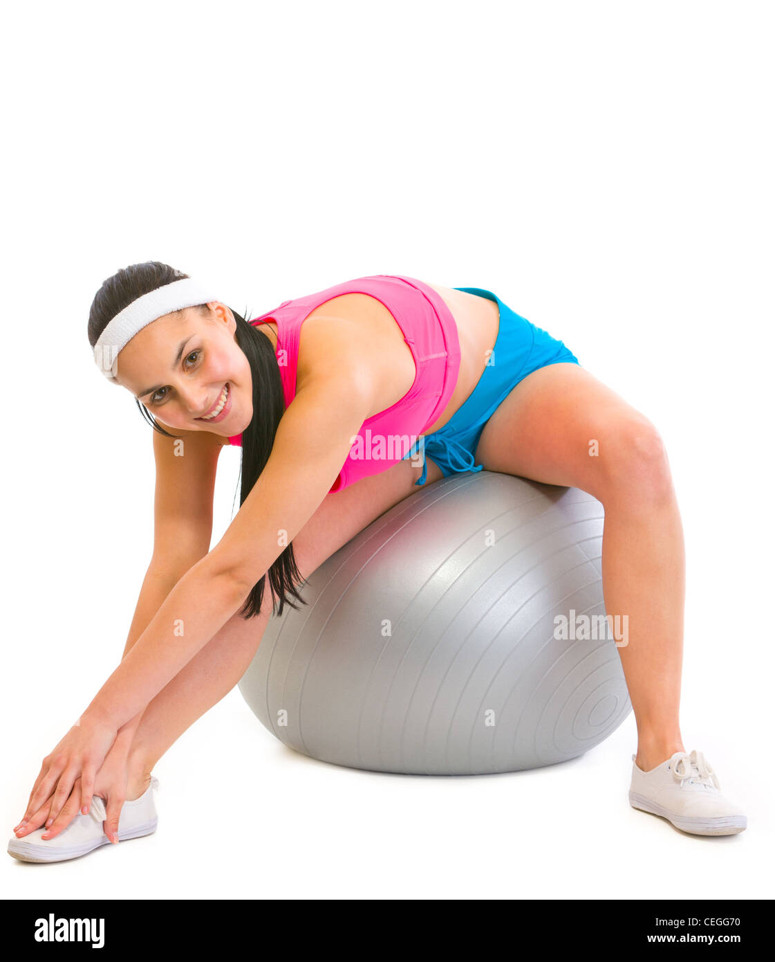 Slim girl making exercises on fitness ball Stock Photo