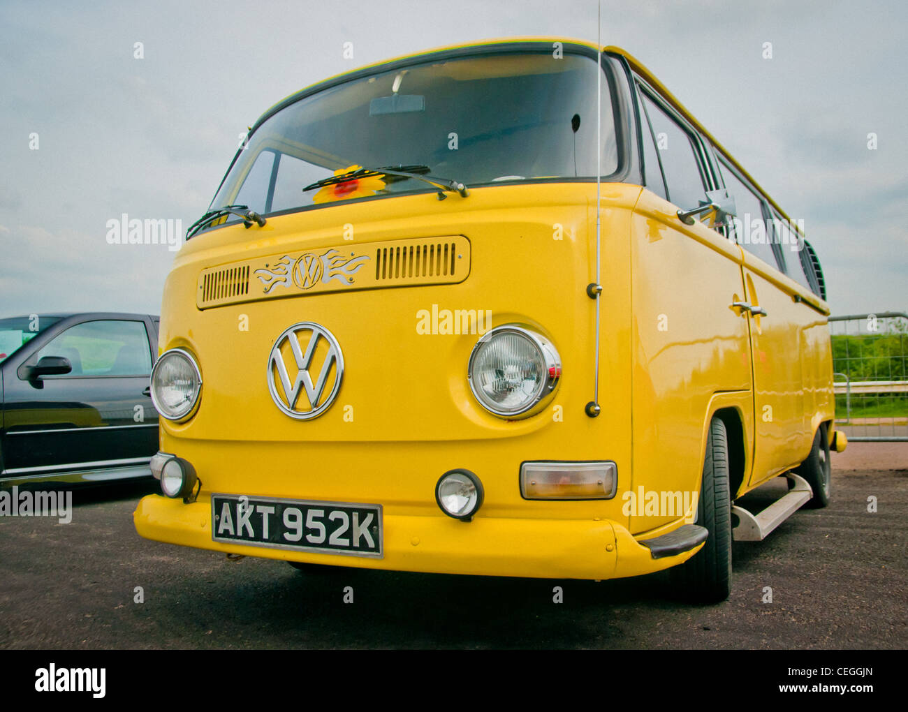 Bright yellow VW Camper van Stock Photo