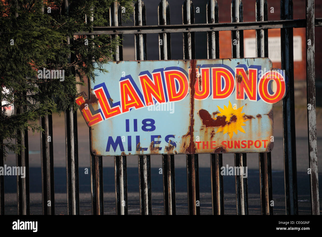 Historic enamel advertising boards which are rusting but still legible Stock Photo