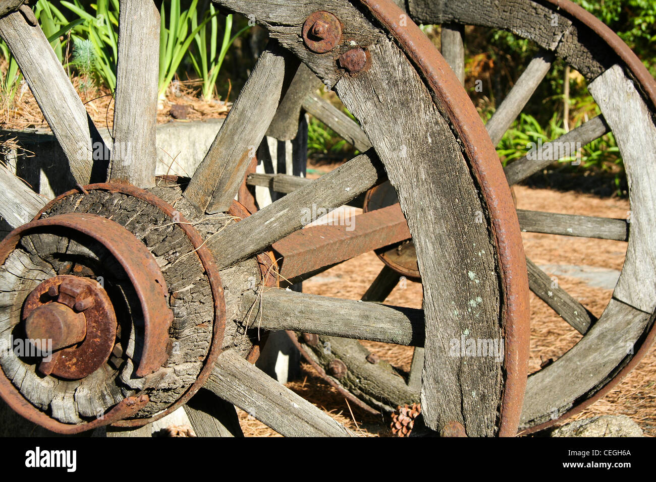 Old wood and iron cart wheels Stock Photo