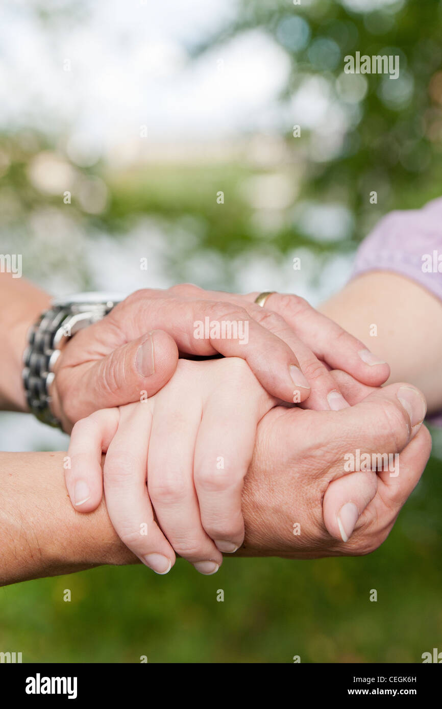 Man and woman holding hands Stock Photo Alamy