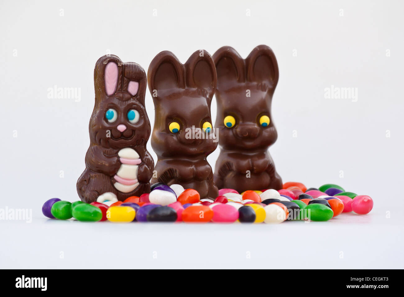 Easter Dark Chocolate Bunnies With Candies Jelly Beans Cut Out Isolated Close Up On White