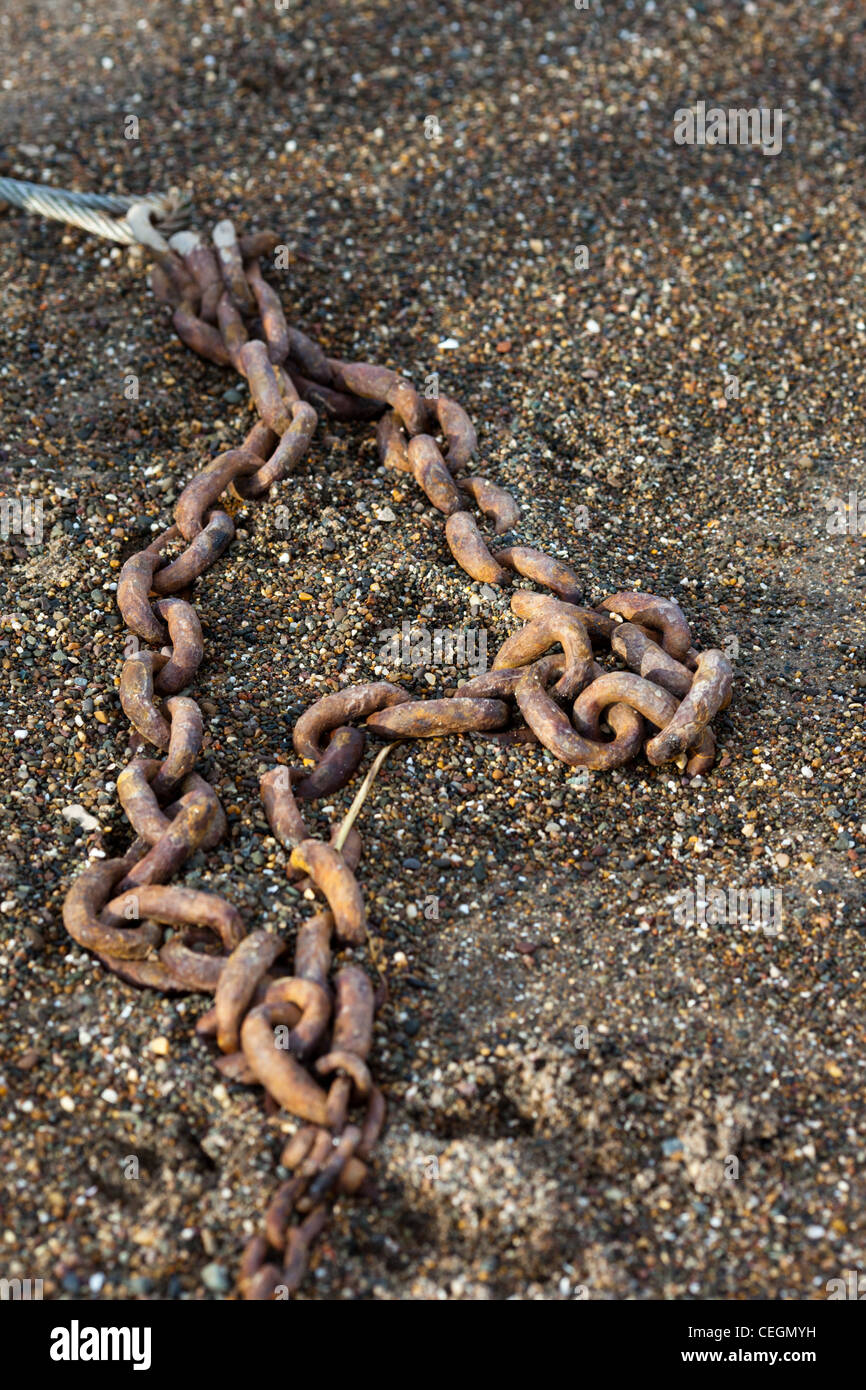 An Anchor chain mooring for a small boat Stock Photo Alamy