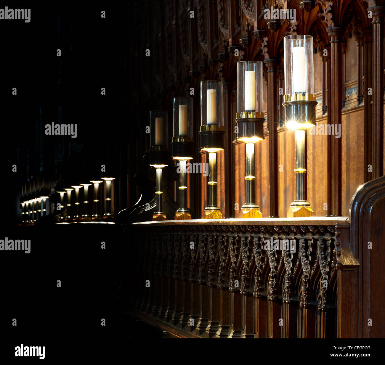 Natural and artificial candle light in the wooden stalls on the