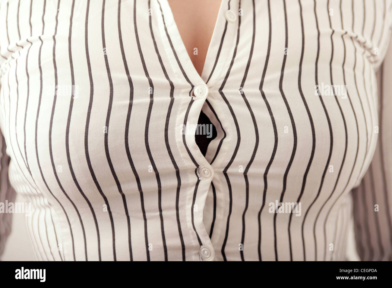 Tight shirt buttons hi-res stock photography and images - Alamy