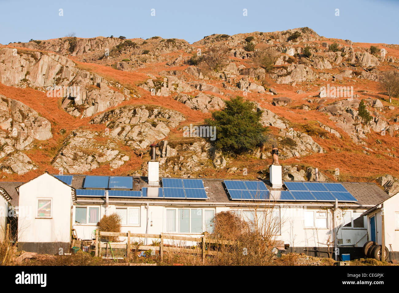 Solar panels on Council houses/ social housing in Chapel Stile in the Langdale Valley, Lake District, UK. Stock Photo