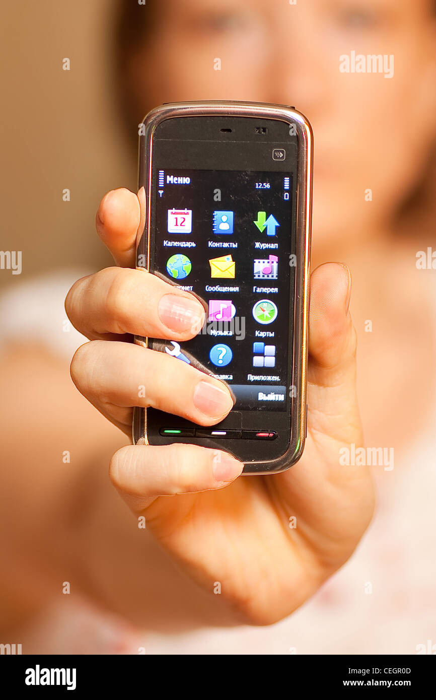 Woman Showing display of touch mobile cell phone Stock Photo