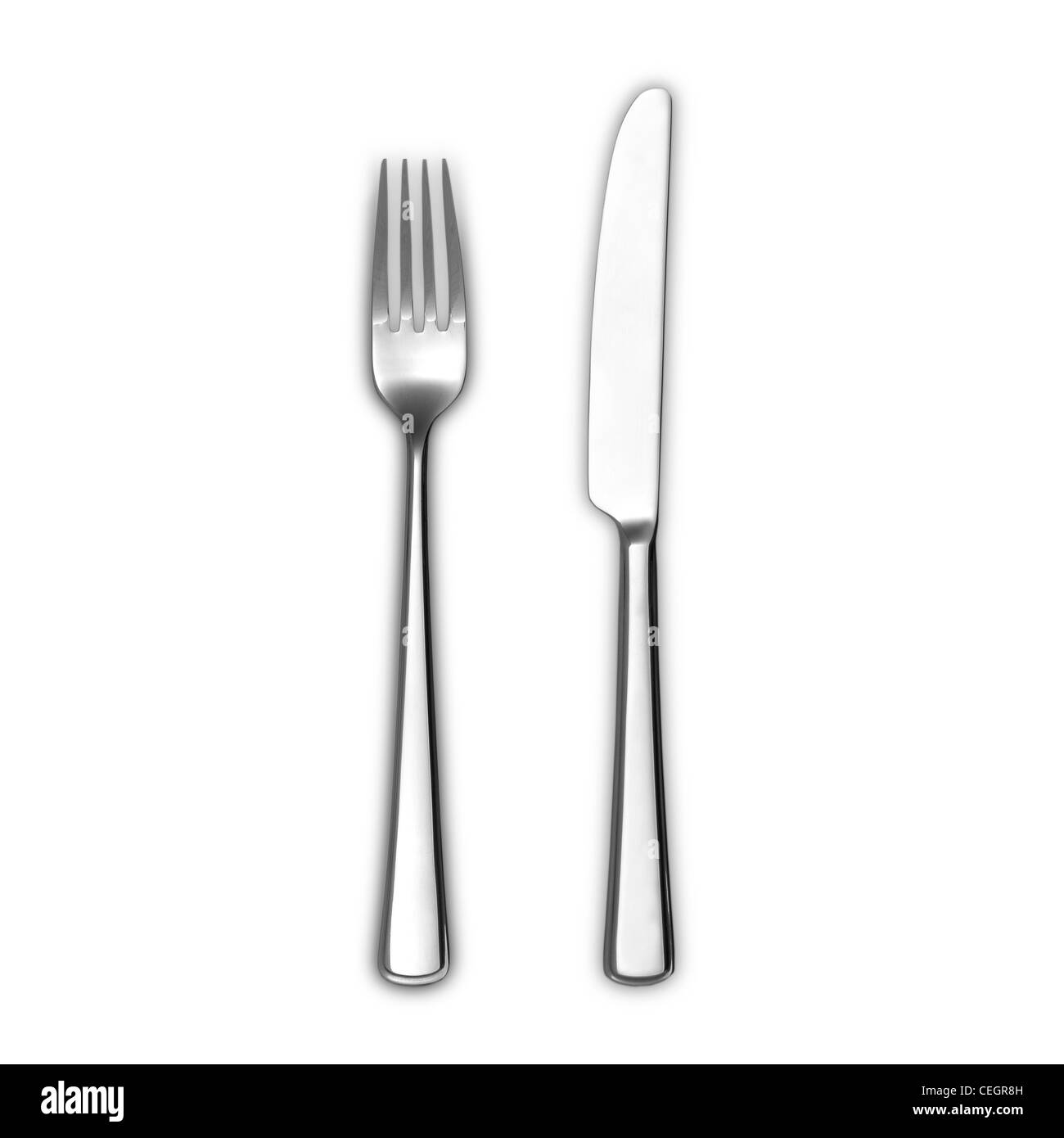 A still life shot of a modern silver stainless steel knife and fork Stock Photo