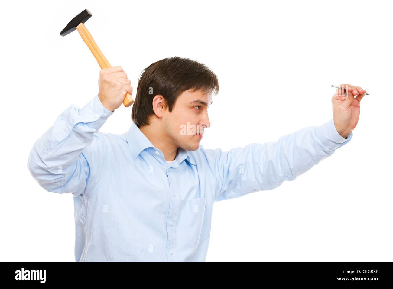 Construction worker hammering nail Stock Photo Alamy