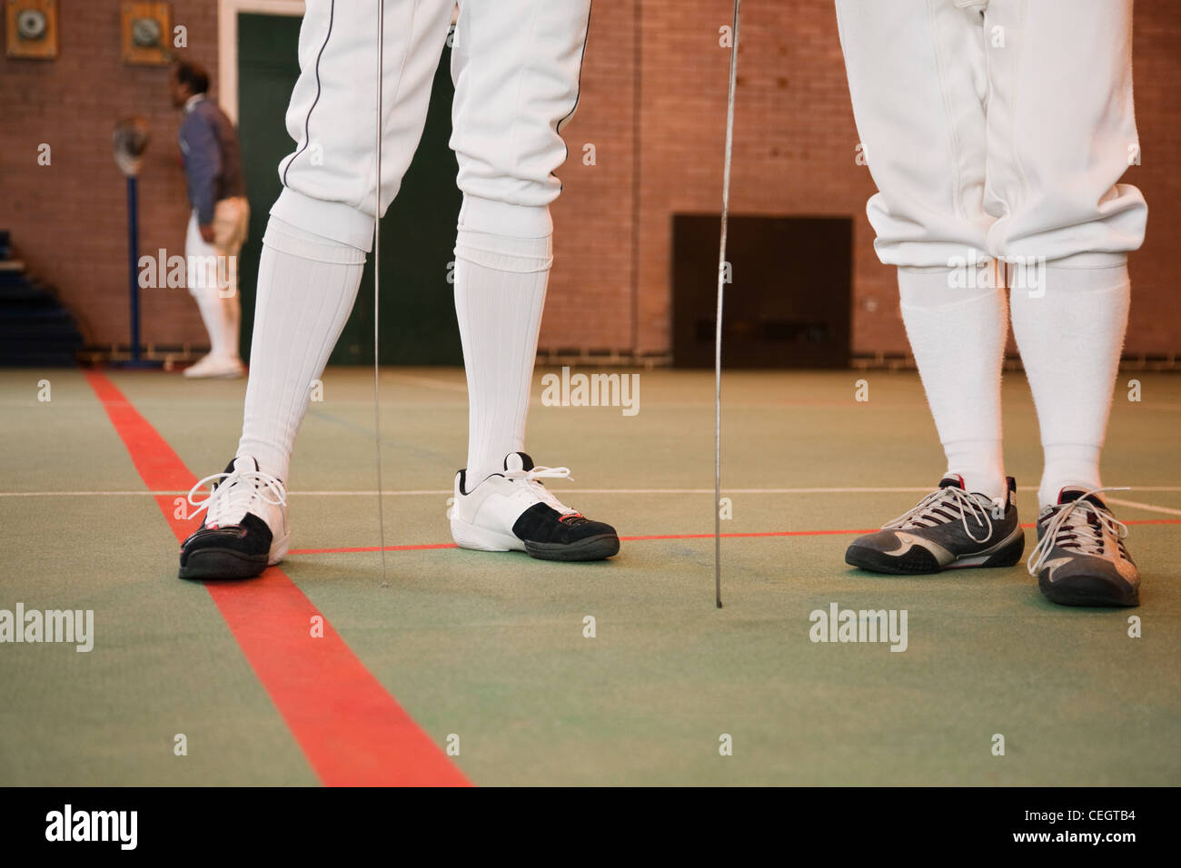 Senior men in fencing suit, low section Stock Photo Alamy