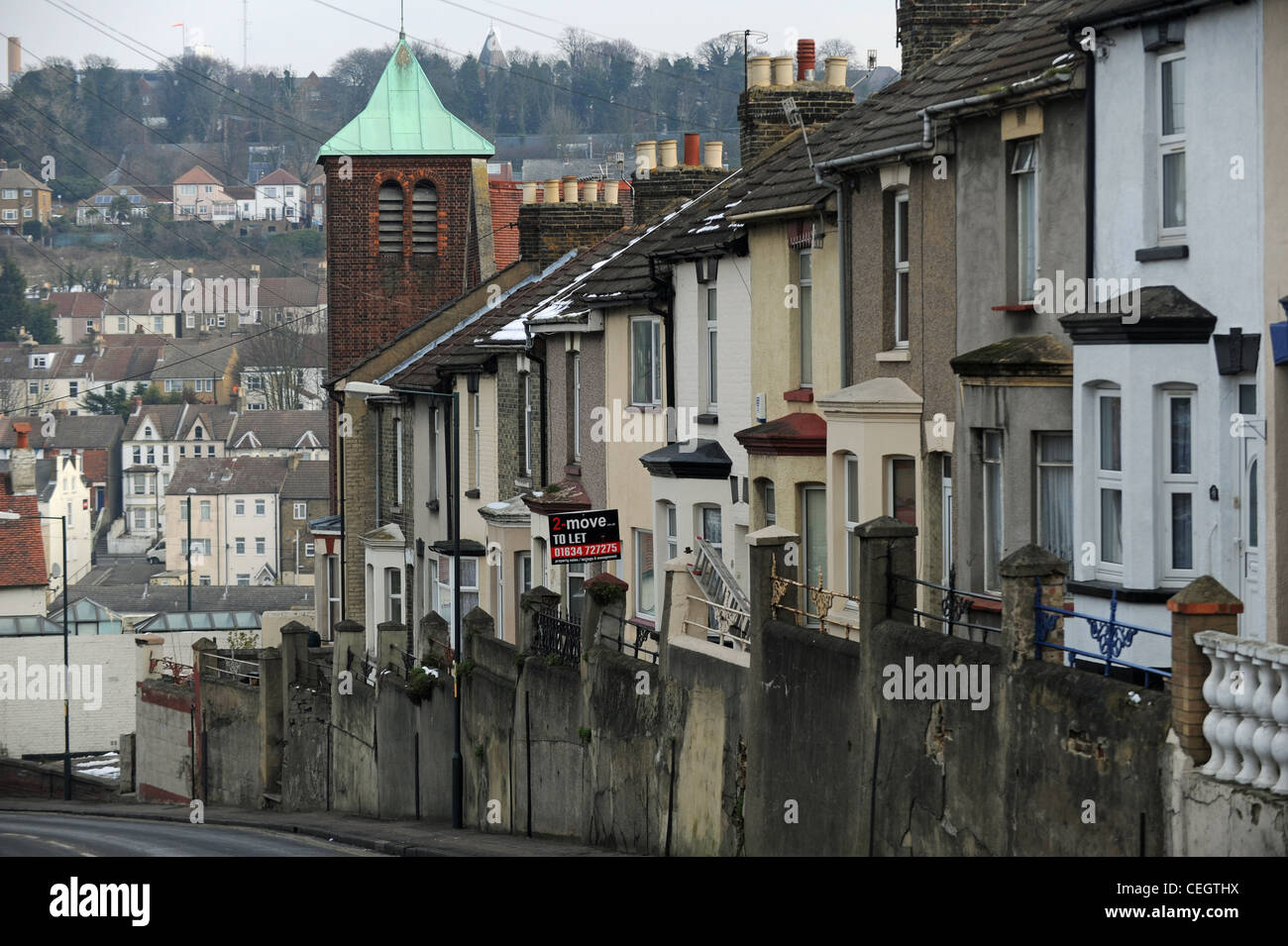 Terraced housing with rental board up in Chatham Kent UK Stock Photo