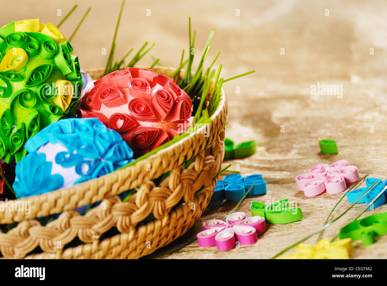 Easter eggs in wicker basket over golden background Stock Photo