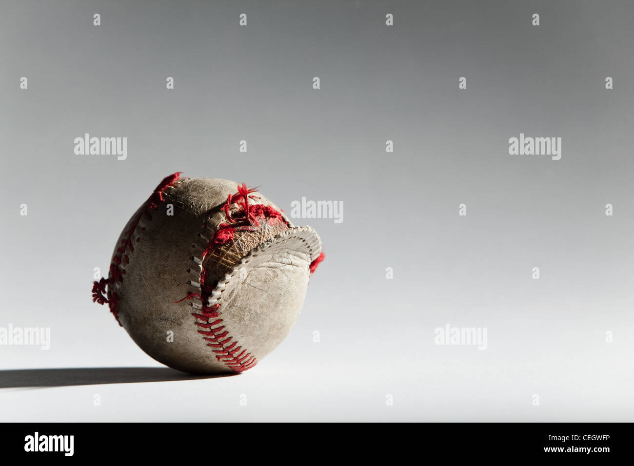 Worn baseball with broken stitching Stock Photo Alamy