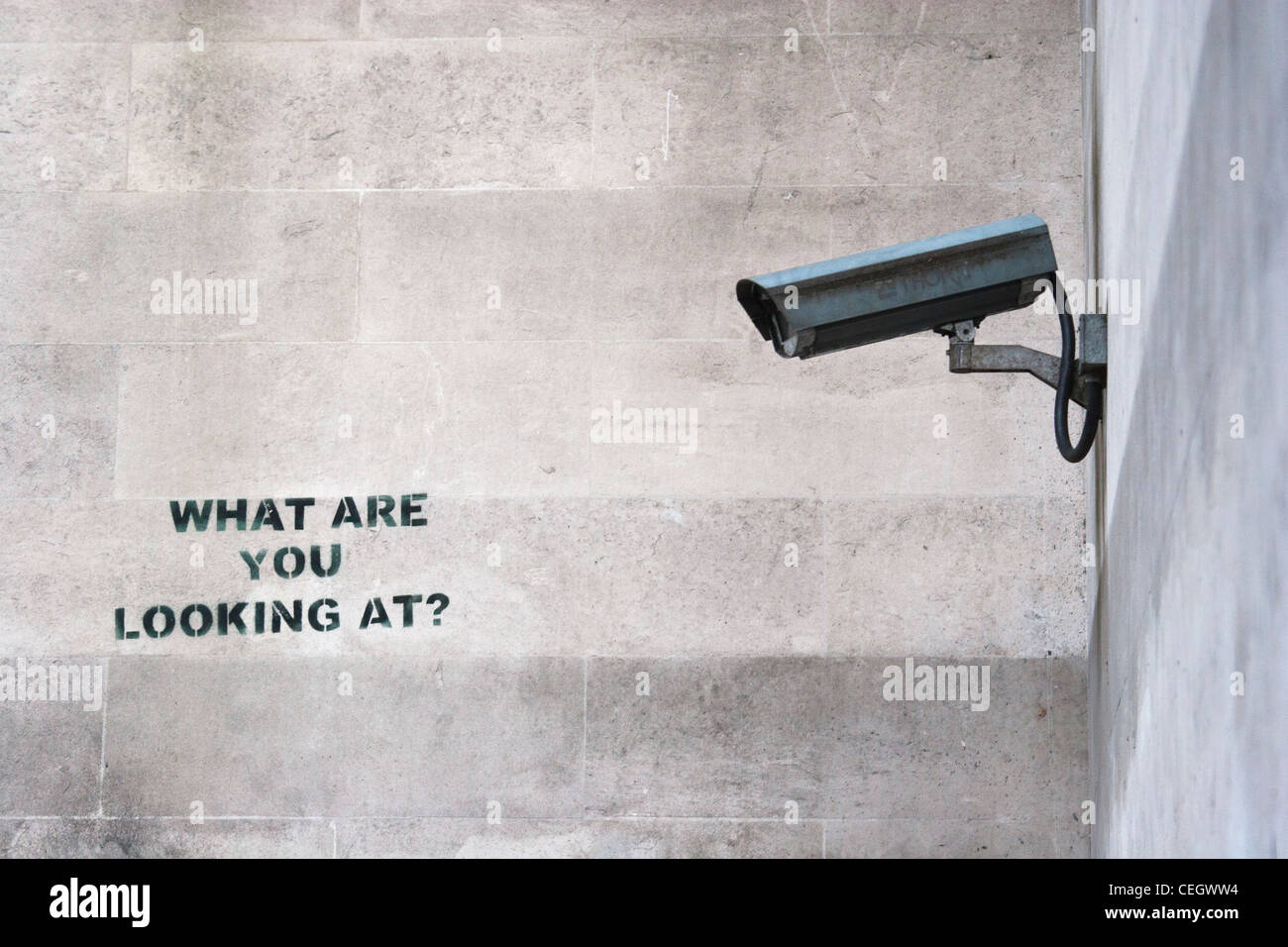 CCTV and 'What are you looking at?' stencil by Banksy, Marble Arch, London. Stock Photo