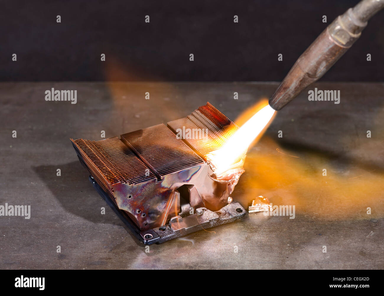 melting heat sink and welding torch on metallic ground Stock Photo Alamy