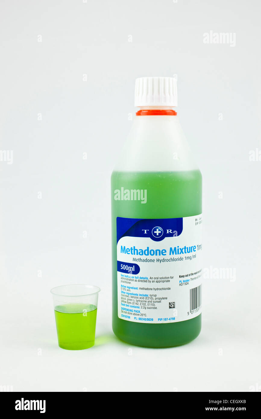 methadone poured in to a  graduated measure to give a measured dose for an addict undergoing treatment Stock Photo