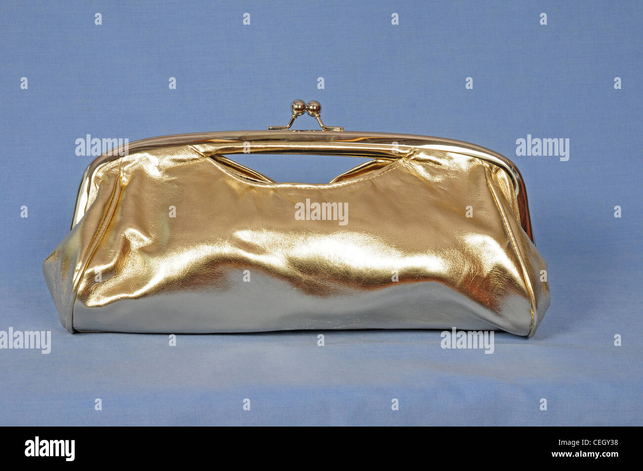 Gold coloured evening clutch bag. 2009 Stock Photo