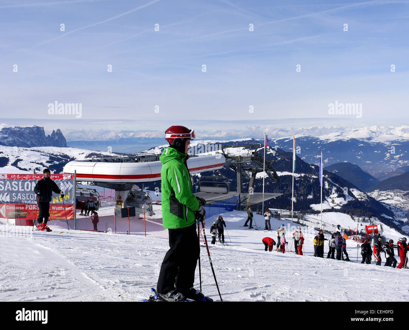 Skiers and snowboarders lat the top station At Selva Wolkenstein on the Sellaronda ski circuit in Italy Stock Photo