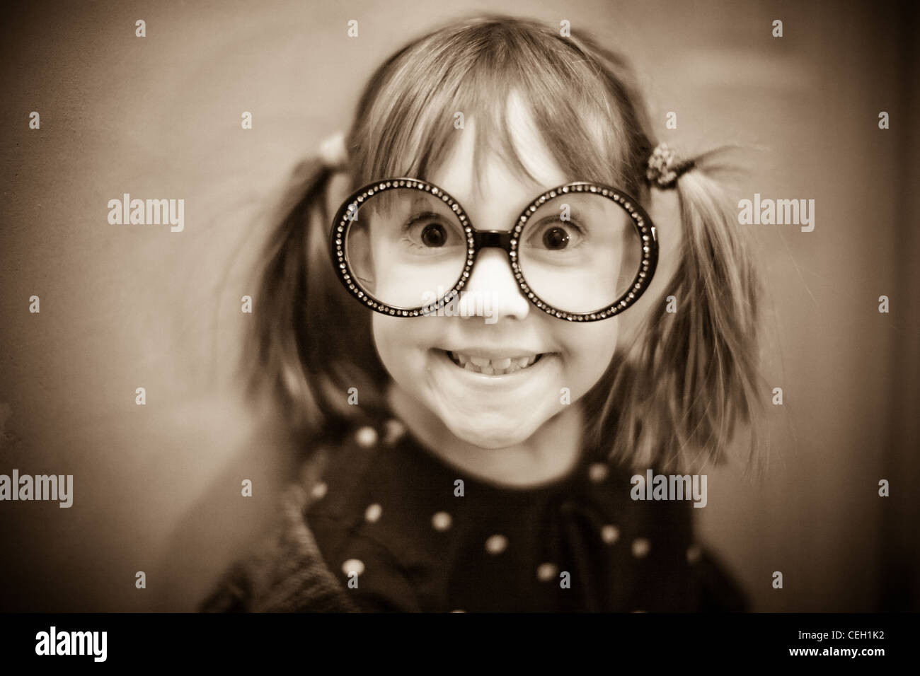 GIrl with big glasses on making a funny face Stock Photo
