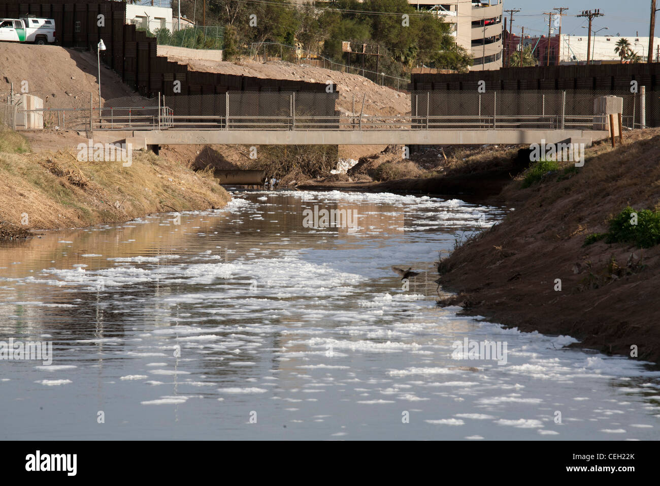 The heavily-polluted New River, as it enters the USA from Mexico Stock Photo