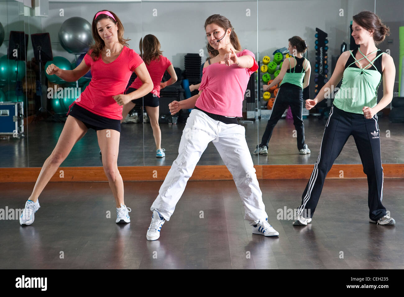 Latin American Zumba dance instructed at a fitness class in UK Stock