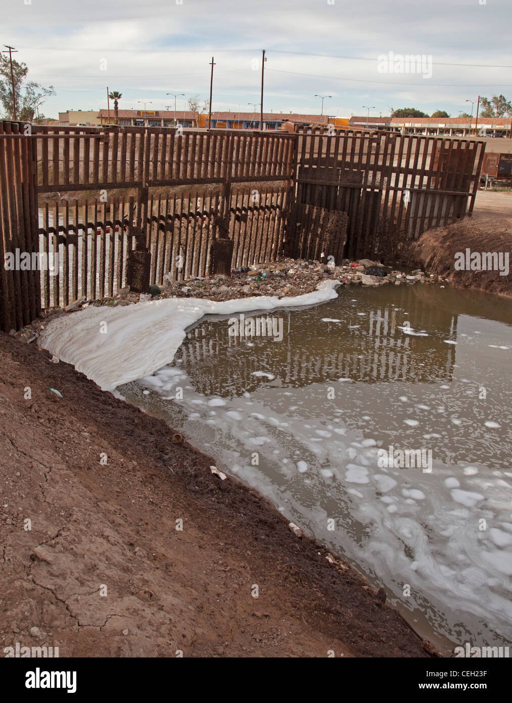 The heavily-polluted New River, as it enters the USA from Mexico Stock Photo