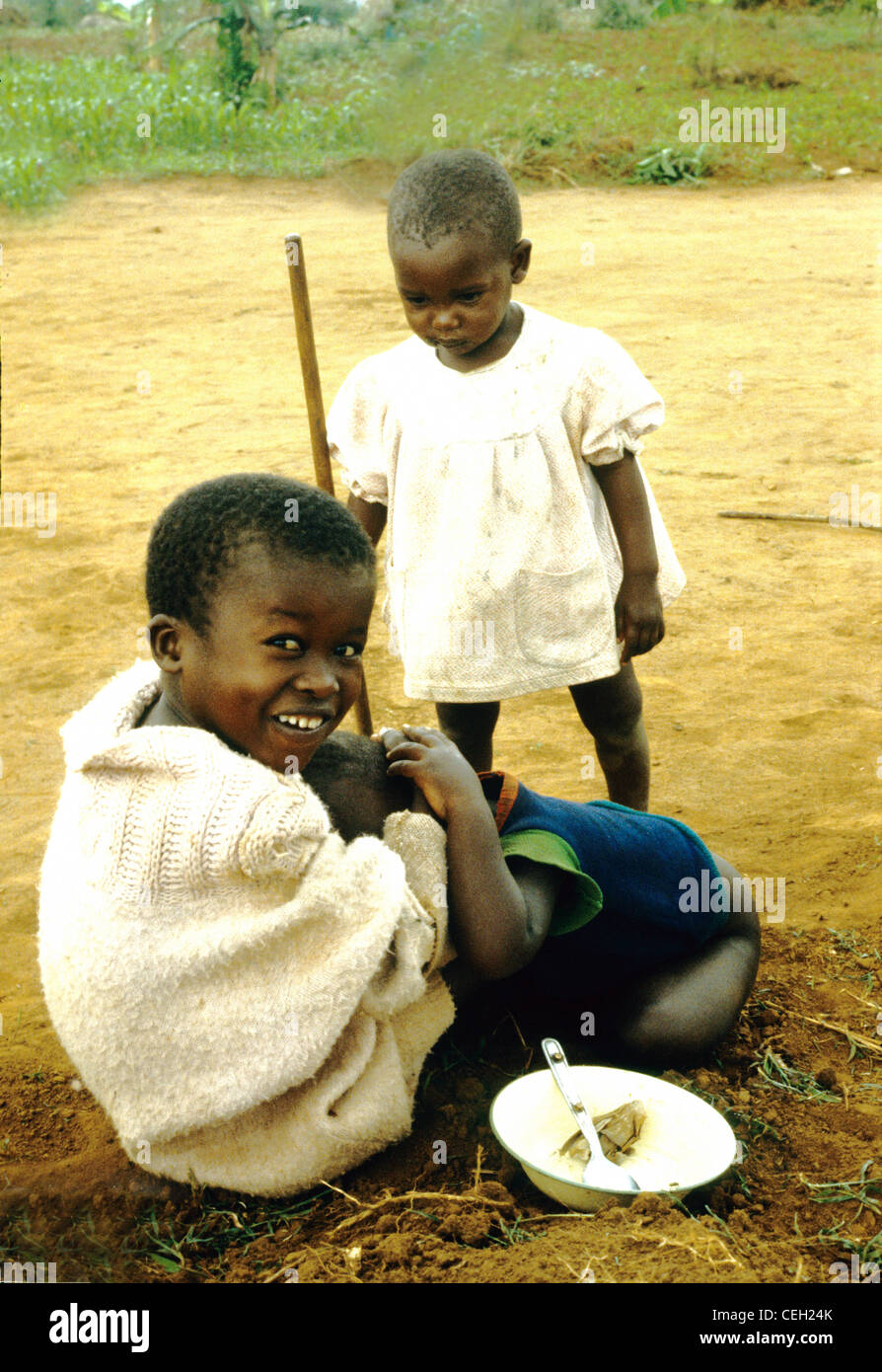 Siblings Rwanda Rwanda .Central Africa. A smiling boy with his little sister Stock ...