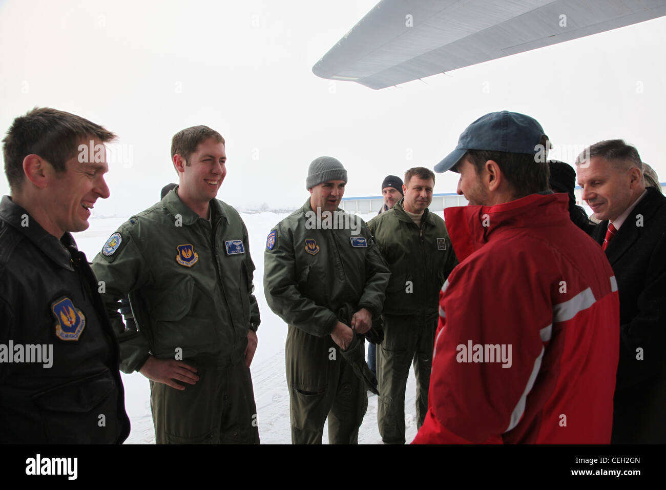 U.S Ambassador to Bosnia Patrick S. Moon, talks to members of the 87th Airlift Squadron from Ramstein AB, Germany in Sarajevo, Bosnia on Feb. 12, 2012. Thanks and appreciation came after a military-to-military exchange between Bosnia and Herzegovina and U.S. Forces Stock Photo