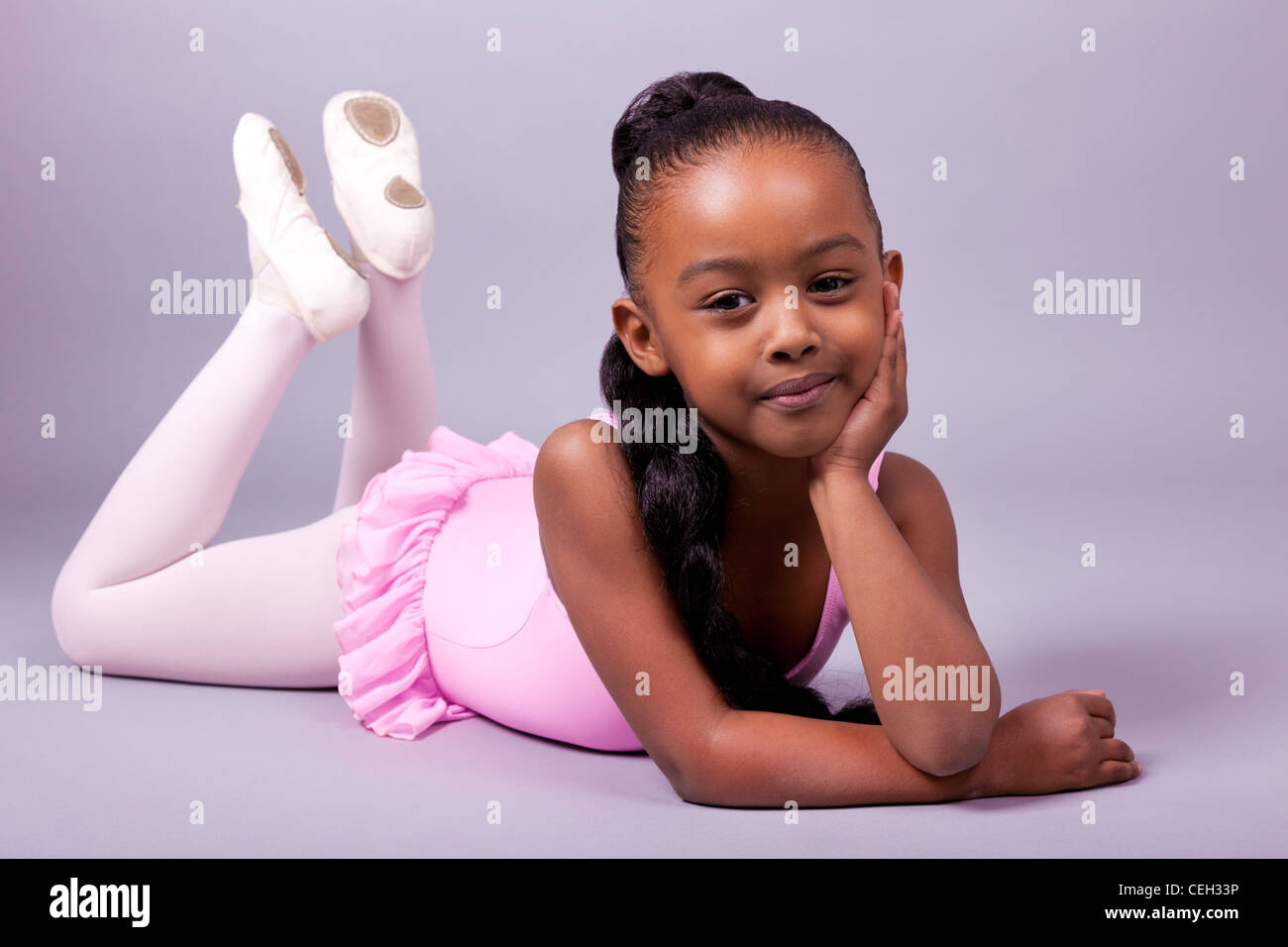 Portrait of a cute little African American girl wearing a ballet ...