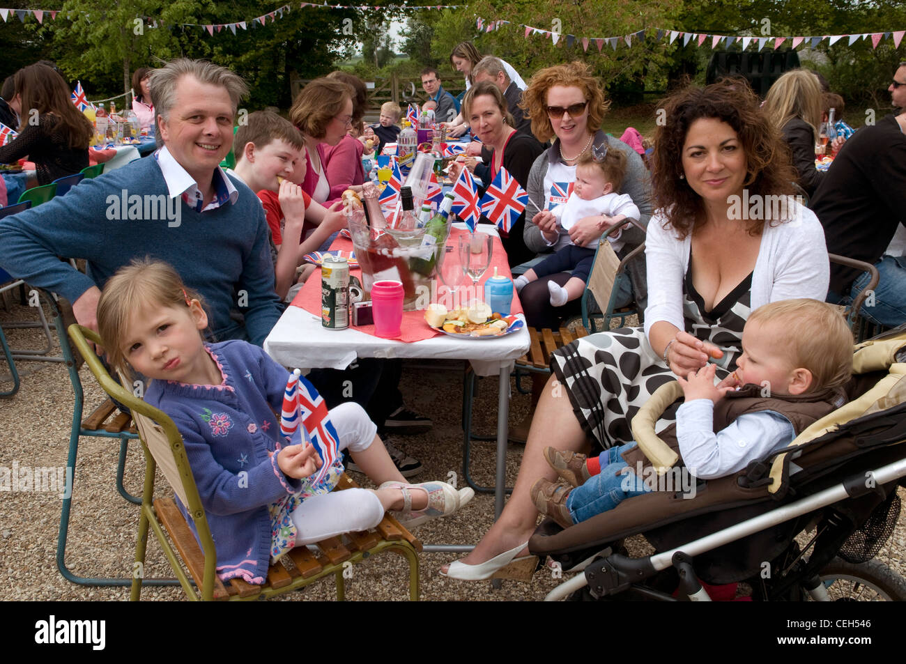 People celebrating at a traditional English Street Party Stock Photo