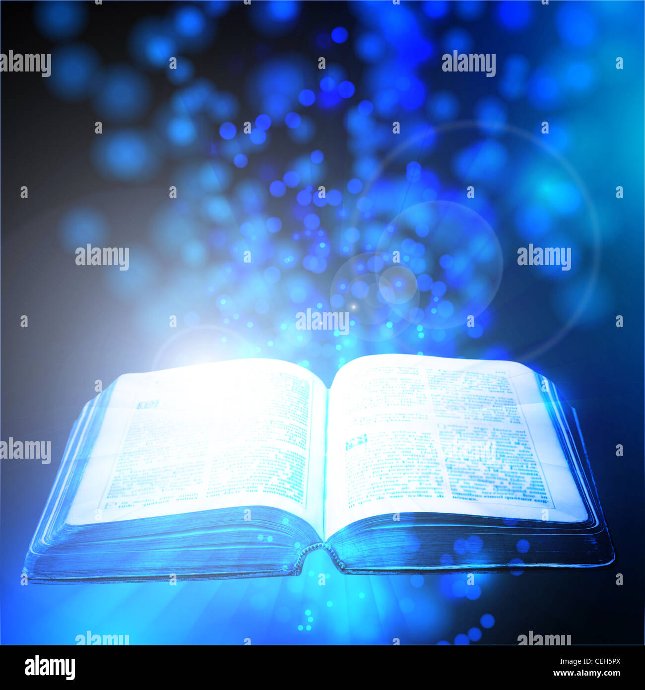 book illuminated the mystical light Stock Photo