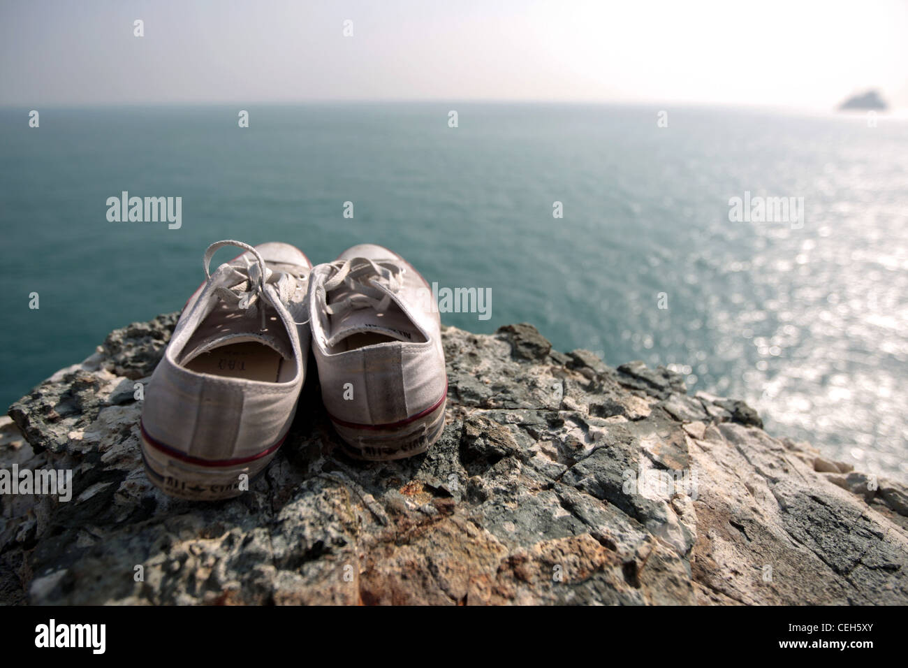 shoes lying in the cliff Stock Photo Alamy