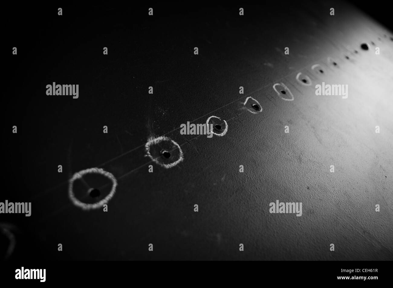 Holes in metal sheet Stock Photo Alamy