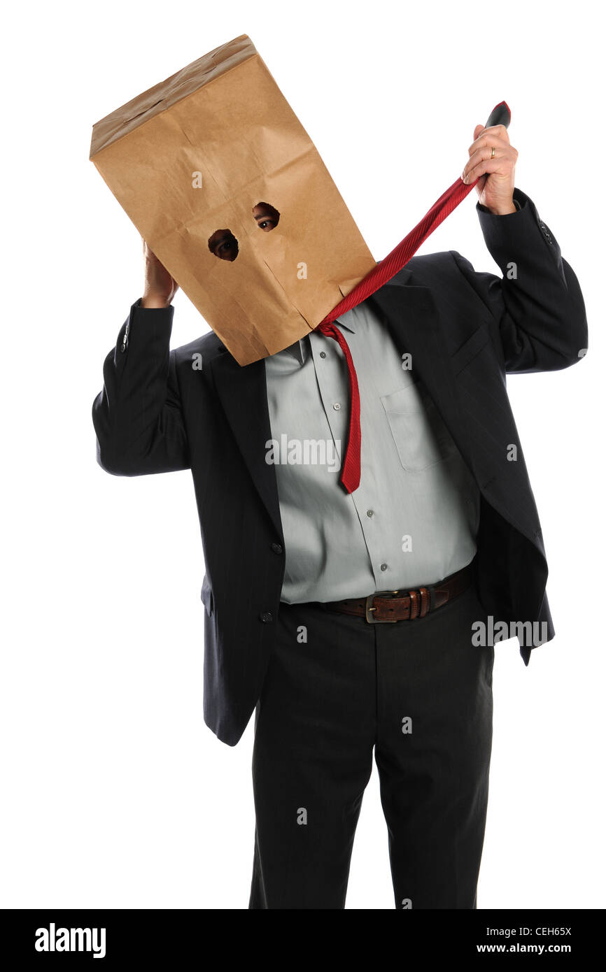 Portrait of businessman with paper bag on head pulling tie isolated over white background Stock Photo