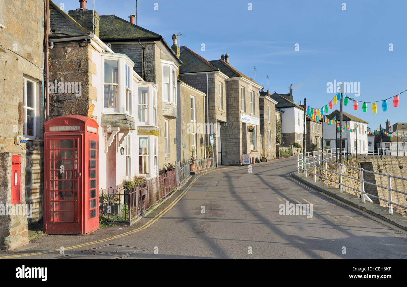 Harbourside street scene in Mousehole, Cornwall, United Kingdom Stock Photo