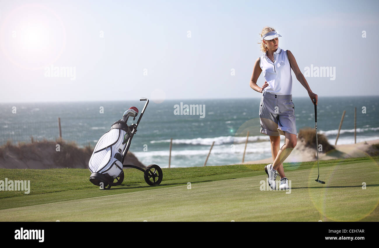 woman Playing golf Stock Photo