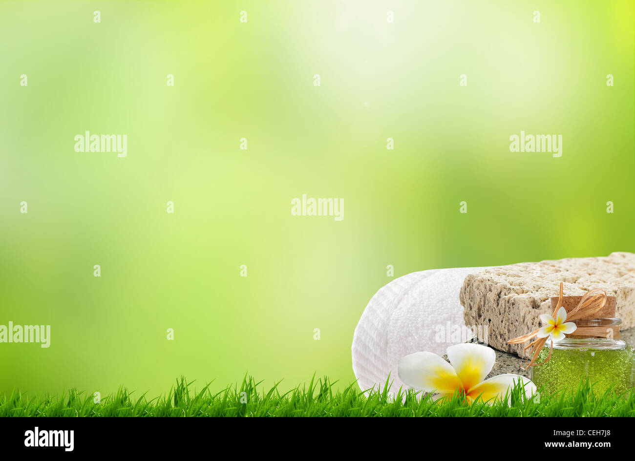 Beautiful green grass and spa towel, beautiful flower Stock Photo