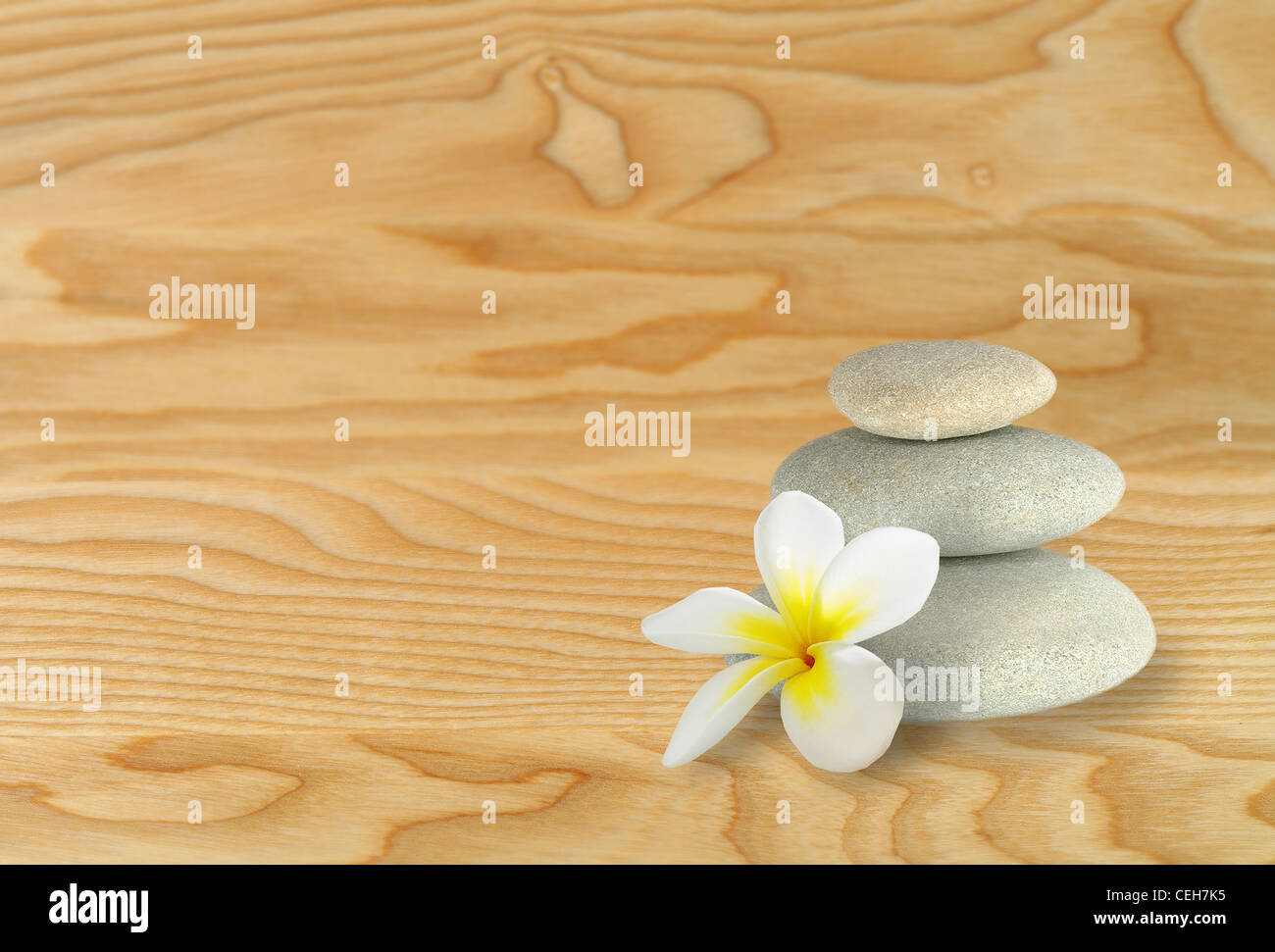 Pebble stones on wooden  surface Stock Photo
