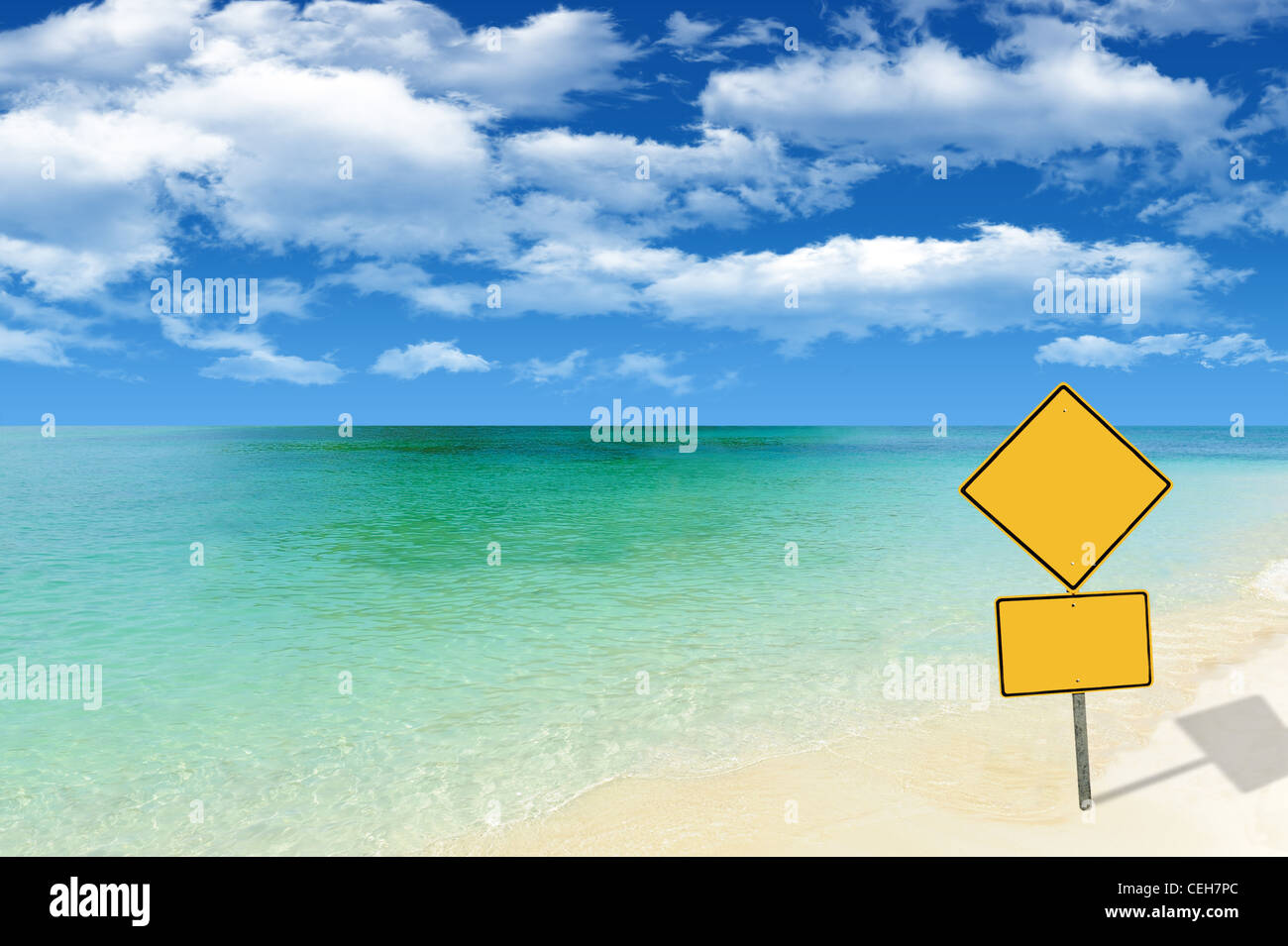Beautiful remote beach with yellow sign Stock Photo