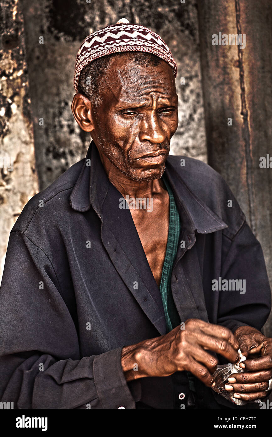 Gambian man/woman in a street market in Gambia,the photo is in colour. Stock Photo