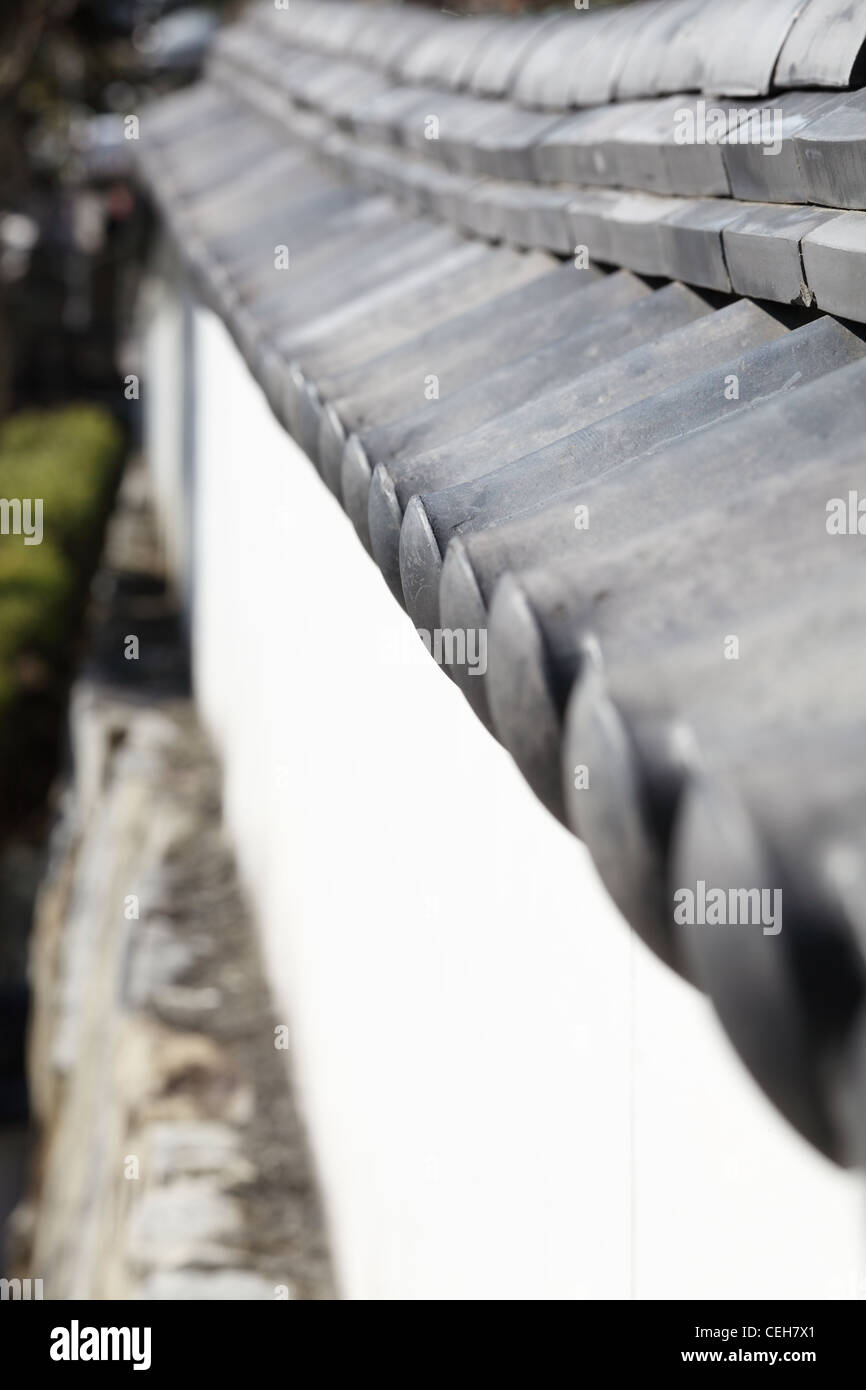 Japanese style wall with roofing tiles Stock Photo
