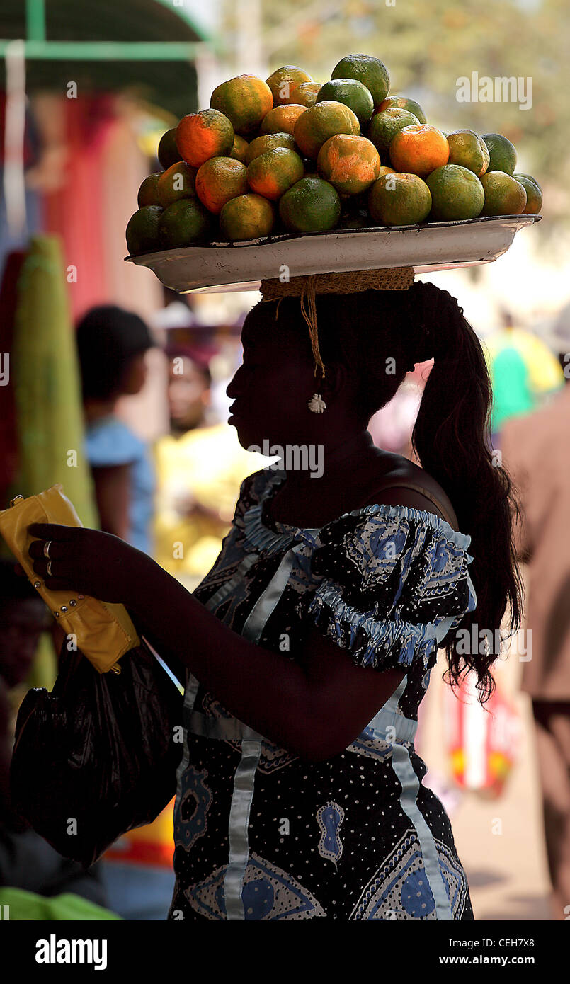 Gambian man/woman in a street market in Gambia,the photo is in colour. Stock Photo
