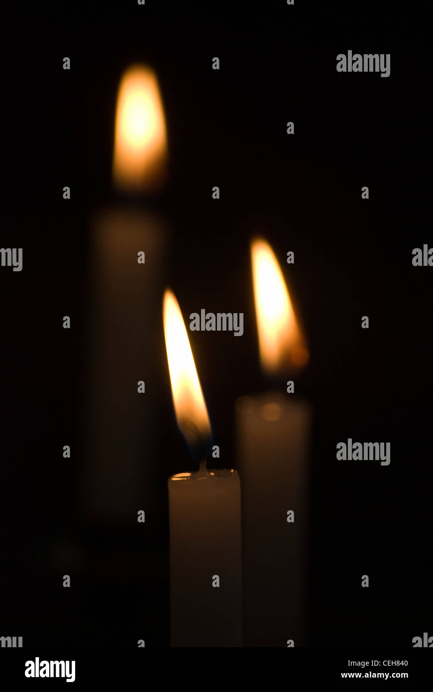 Closeup of flickering candles inside of church Stock Photo Alamy