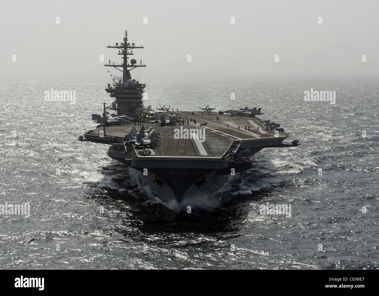 The Nimitz-class aircraft carrier USS Carl Vinson is underway in the Arabian Sea. Carl Vinson and Carrier Air Wing (CVW) 17 are deployed to the U.S. 5th Fleet area of responsibility. Stock Photo