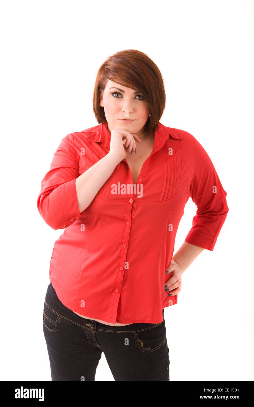 Slightly overweight woman standing with a hand on her hip. Stock Photo