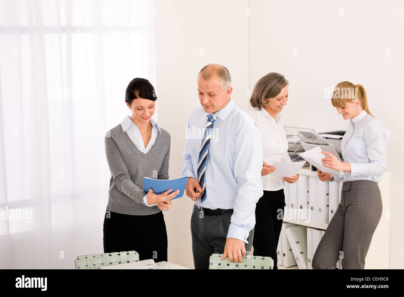 Sales meeting business people review reports consulting new strategy Stock Photo