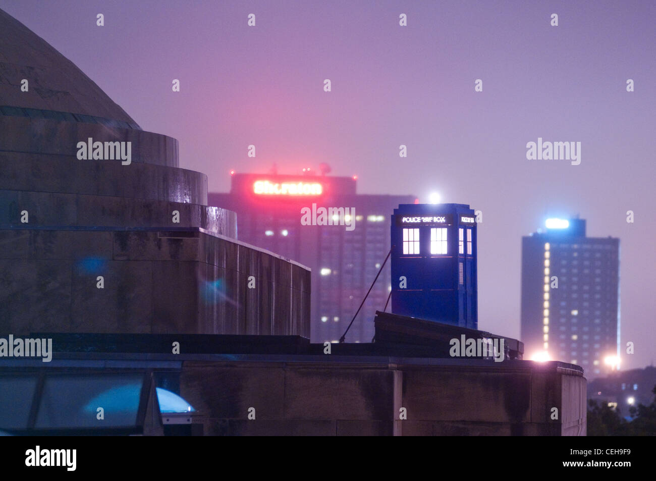 Hackers installed an illuminated 'Doctor Who'-style police call box ('TARDIS') on the roof of Building 7 overlooking the 77 Mass Ave entrance for the beginning of Rush/Freshman Orientation, along with a banner reading 'The Doctor: 1 / Harvard: 0'. Stock Photo